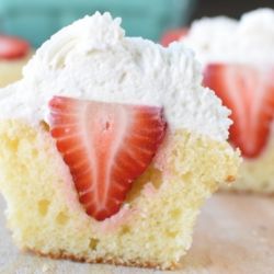 Strawberry Shortcake.  Vanilla Cupcake filled with a fresh Strawberry and Stiffened Whipped Cream Frosting.