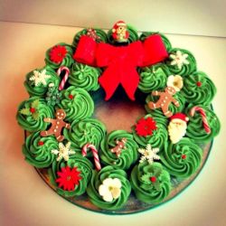 Christmas Wreath Pull Apart Cupcake Cake. Green Velvet Cupcakes, Butter Cream Frosting and Candy decorations.