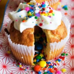 Cinco de mayo Pinata Cupcake. Vanilla Cupcake filled with Candy Sprinkles. topped with Butter Cream Frosting and Sprinkles.