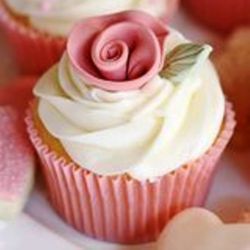 Pink Rose. Rose Water Cupcake with Butter Cream Frosting and Candy decorations.