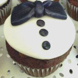 Tuxedo. Any flavor cupcake with Butter Cream Frosting and Candy decorations