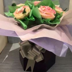 Pink Rose Cupcake Bouquet. Any flavor Cupcakes with Butter Cream Frosting in a decorative Cupcake Box.