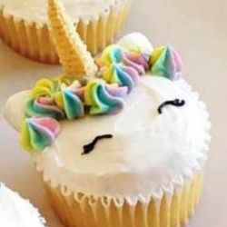 Unicorn. Angel Food cupcakes with Butter Cream Frosting, Bugle horn and Candy decorations.