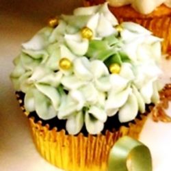 Hydrangea Flower. Any flavor Cupcake with any color Frosting and Candy Beads.