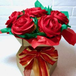 Red Rose Cupcake Bouquet. Any flavor Cupcakes with Butter Cream Frosting in a decorative Cupcake Box.