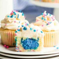Gender Reveal Cupcake. Vanilla or Funfetti Cupcake.Cream Cheese Filling. White Chocolate Butter Cream Frosting and Sprinkles.